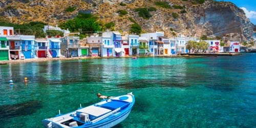 Scenic Klima Village in Milos, shore view from the boat